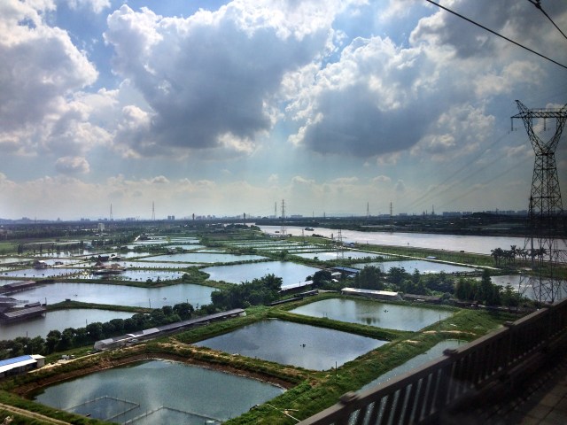Fish ponds and a great rivers from the fast train to Changsha.